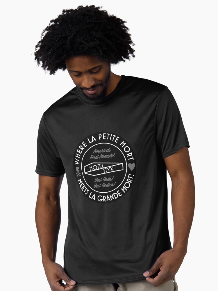 Shirt with La Petite Logo which is a Motel Styx logo inside a circle with a border reading Where La Petite Mort Meets La Grande Mort